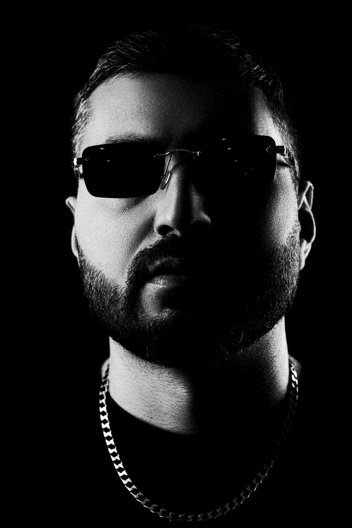 Halftone portrait of ALIGEE facing the camera, in sunglasses and a chain